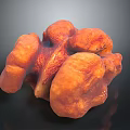 Orange Fleshy Fungus with Wrinkled Surface in Clumpy Shape on Dark Background
