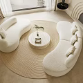 Elegant Plush White Curved Sofa and Coffee Table Set With Round Table Plant And Books