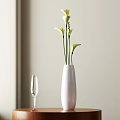 White Vase with White Calla Lilies Next to Wine Glass on Wooden Table Home Decor