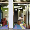 Garden Landscape With Children's Play Area Wooden Slide Rocking Horses And Colorful Balls