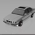 Classic White BMW Sedan With Sleek Body Lines And Black Wheels