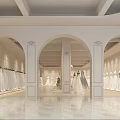 Elegant Bridal Shop Display With Red Walls White Pillars And Wedding Dress Mannequins