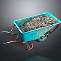 Blue Garden Wheelbarrow Filled With Dark Soil And Rusty Metal Handles