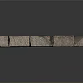 Stacked Gray Natural Stone Blocks With Textured Surface And Decorative Arrangement