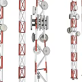 Red and White Communication Towers With White Antennas Satellite Dishes Against Blue Sky