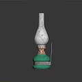 Green Glass Bottle With Silver Top On Blue Square Mat With Brown Spots