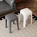Gray and White Stools on Carpet with Sofa and Wooden Floor