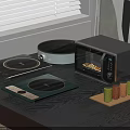 Modern Kitchen Countertop With Induction Cooktops Microwave Oven And Spice Jars