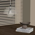 Modern White Pendant Light Hanging Above Wooden Table With Bowl And Books Near Window Blinds