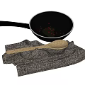 Essential Kitchen Utensils Frying Pan Wooden Spoon and Gray Cloth with Oil and Red Spices