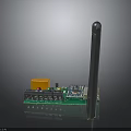 Electronic Green Circuit Board Module With Orange Square Component Blue Chip Long Black Antenna