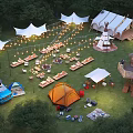 Scenic Camping Site With Various Tents String Lights Camping Car And Tree House
