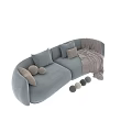 Modern Two Seater Sofa In Light Blue And Beige With Soft Pillows And Cozy Blanket