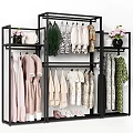 Colorful Clothes Hanging On Black Metal Rack With Floral Patterns And Pink Flowers Vase