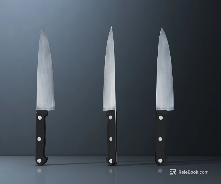 Three Piece Kitchen Knife Set With Silver Blades And Black Handles 3d model