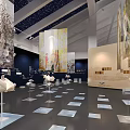 Art Exhibition Space With Large Mural Sculptures And Book Shaped Installations