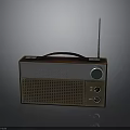Vintage Electronic Radio With Brown Silver Design Black Handle And Antenna