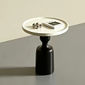 Modern Round Side Table With White Top Black Base Metal Balls And Book