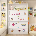 White Chest of Drawers with Colorful Cartoon Stickers and Knobs in Kids Room