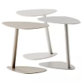 Three Modern Light Toned Side Tables With Slim Legs And Minimalist Design
