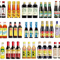 Various Types Of Condiment Bottles With Different Labels For Kitchen Use