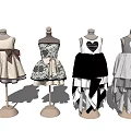 Mannequins Displaying Various Style Dresses With Bow Heart Pattern And Layered Skirts