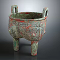 Ancient Bronze Tripod Cauldron With Intricate Patterns Double Handles And Green Patina