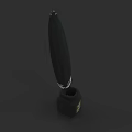 Black Feather Pen with Silver Accents Placed on Black Inkwell with Golden Logo