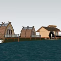 Scenic Traditional Ancient Huts by Water with Thatched Roofs Verandas and Water Reflections