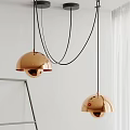 Two Modern Copper Pendant Lights with Hemispherical Design Hanging in Minimalist White Interior
