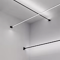 Minimalist White Interior With Horizontal Metal Hanging Rods And Lighting