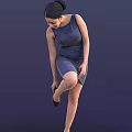 A Woman in Blue Dress Lifting One Leg and Adjusting Shoe Against Dark Blue Background