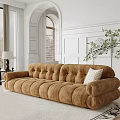 Brown Tufted Large Sofa With White Pillow In Room With Arch Window And Green Plant