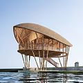 Scenic Overwater Bamboo Guesthouse With Thatched Roof And Wooden Support Structure