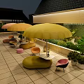 Stylish Outdoor Sofa Setup With Yellow Umbrellas Green Plants And Paved Patio