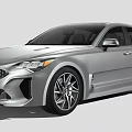 Silver Sports Car With Streamlined Body Front Grille And Multi Spoke Wheels