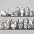 Various Ceramic Vessels with Blue and White Patterns as Decorative Pen Holders on Shelf