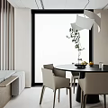 Modern Dining Room with Black Round Table White Chairs Vase Green Plants and Lemons