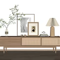 Natural Wood TV Stand with Rattan Drawers Green Plant Vase Framed Art and Linen Shade Lamp