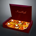 Open Red Box of Swiss Cafe Chocolates Arranged Neatly with Golden Lining and Cream Topping