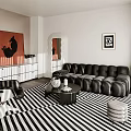 Modern Living Room Interior With Black Leather Sofa Striped Rug Red Artwork And White Sideboard
