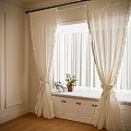 Cream Frilled Curtains With Window Seat Cushion And Potted Plant In Bright Room
