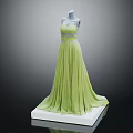 Elegant Green Strapless Long Dress With Decorated Waist And Flowy Skirt On Mannequin