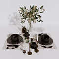 Elegant Tableware Set with Black Plates Bowls Golden Candle Holders Green Plants and White Placemats