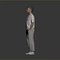 Man Standing Hands in Pockets Wearing White T-Shirt Gray Sweatpants White Sneakers on Gray Background