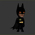 Chibi Batman Character In Black Costume With Yellow Eyes And Cape