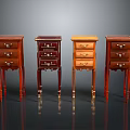 Four Different Colored Small Wooden Cabinets With Drawers And Slender Legs On Dark Background