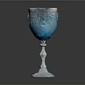 Elegant Blue Glass Goblet With Silver Floral Patterns And White Base