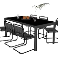 Black Glass Top Dining Table Set with Metal Frame Six Gray Chairs Oranges Green Plant