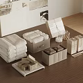 Neatly Arranged Home Accessories With Towels Storage Boxes On Wooden Table